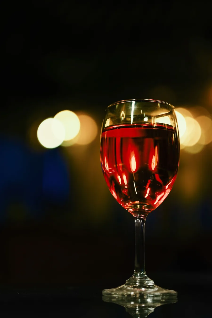 Glass of red wine in the evening, a common reason people sleep hot